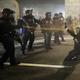A demonstrator is pepper sprayed by DHS troops before being arrested on July 29, 2020, in Portland, Oregon.